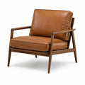 Fauteuil en cuir marron avec structure en bois de noyer
